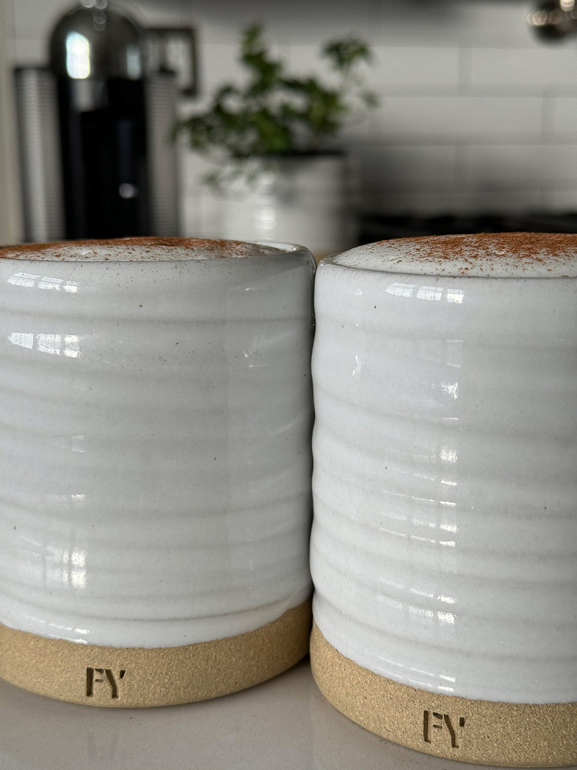 Two 12oz reusable mugs with latte