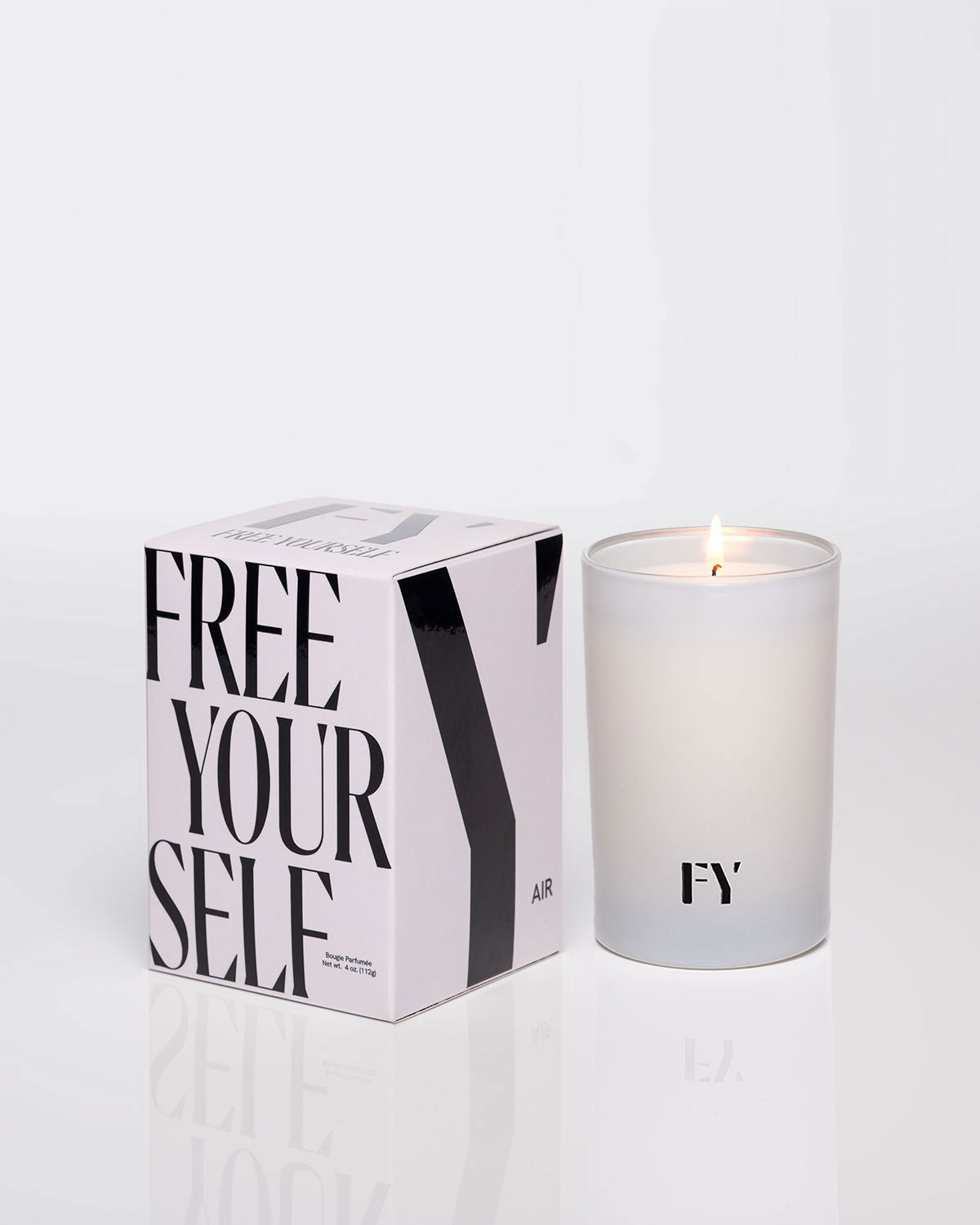 Free Yourself 4oz lit candle in carton vessel