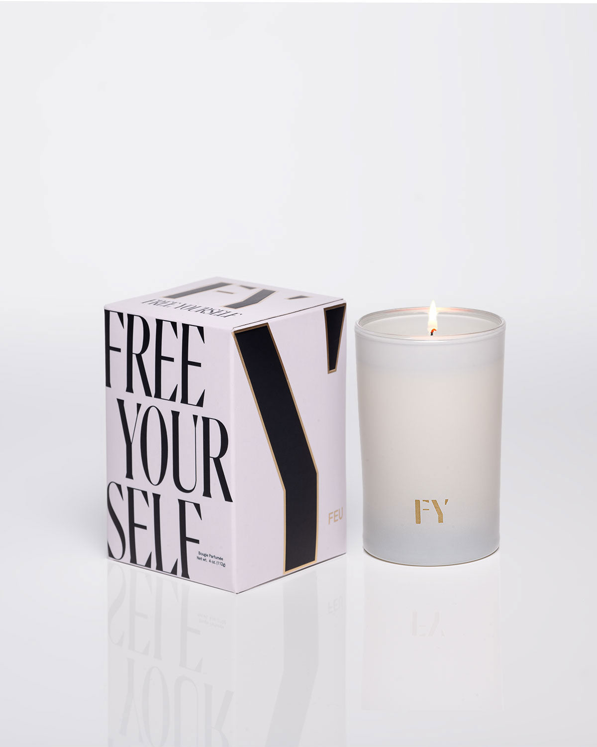 Free Yourself 4oz candle and box, lit