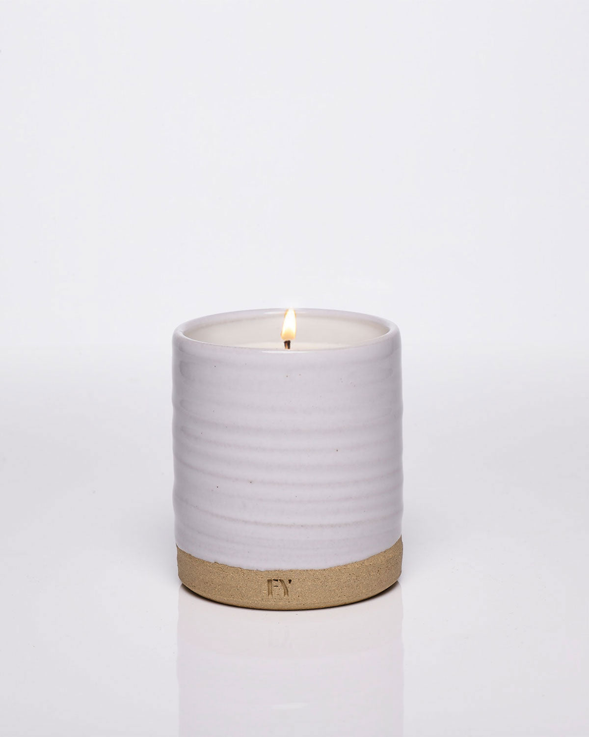 Lit hand-poured candle from Vermont, clean fragrance