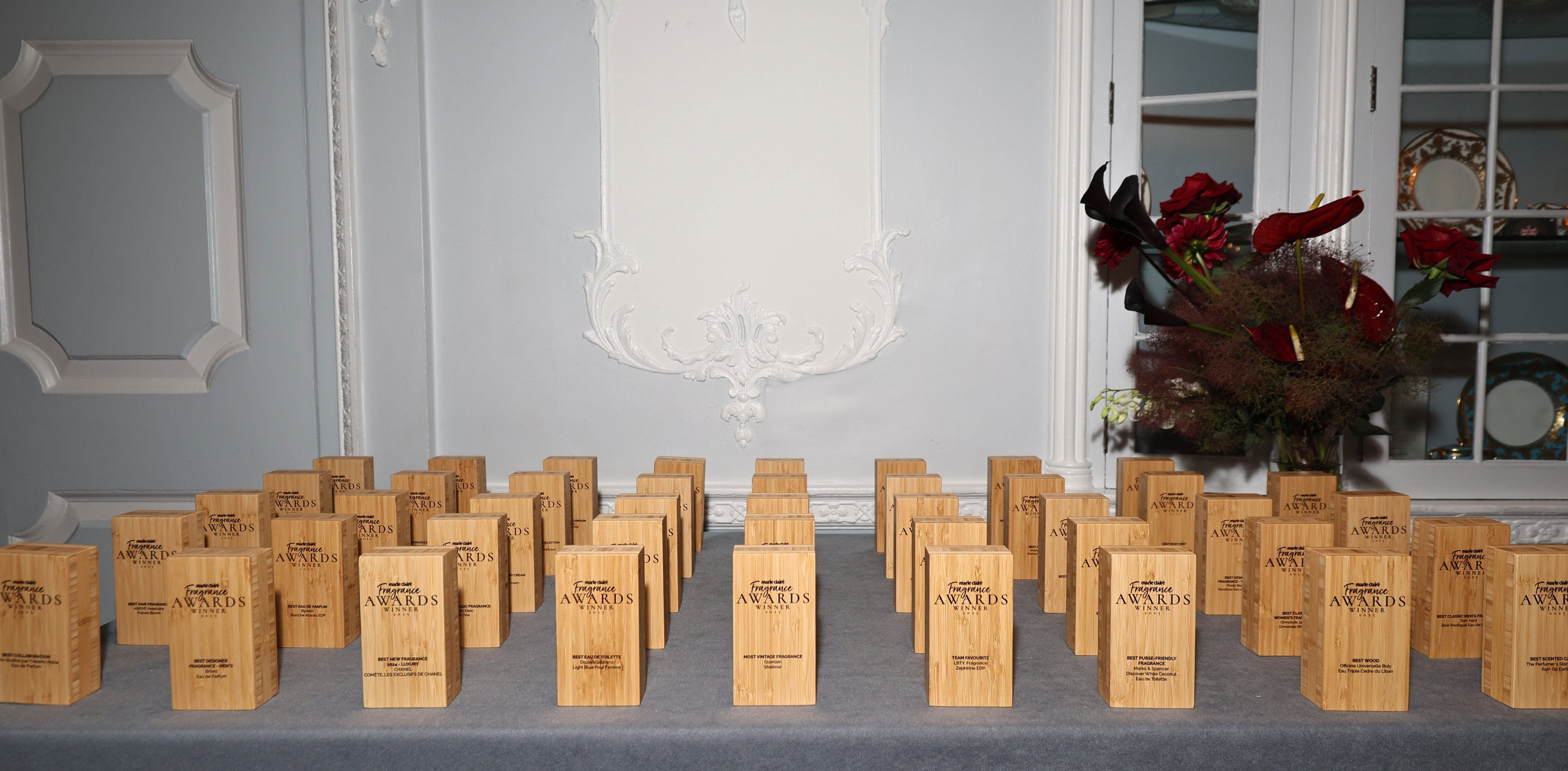 MC Awards table with multiple wooden awards.