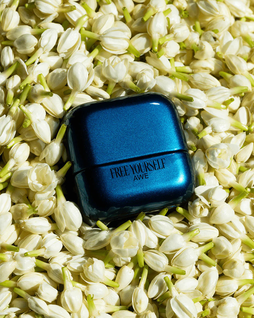 best-selling perfume resting in flowers