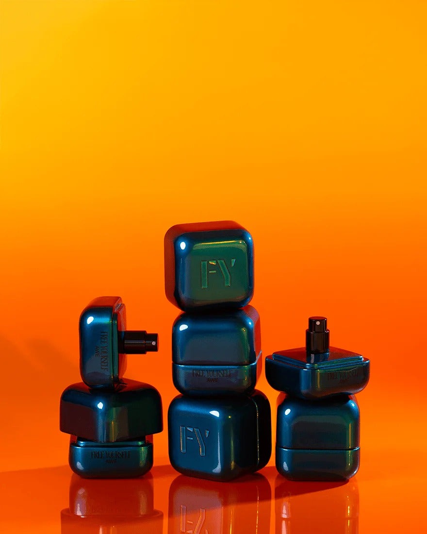 various good perfumes in blue perfume bottles against an orange background