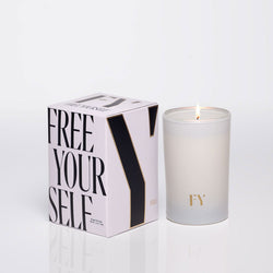 Free Yourself 4oz candle and box, lit