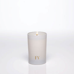 Lit FREE YOURSELF 4oz candle in FEU vessel