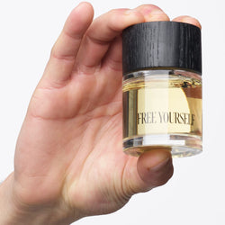 FREE YOURSELF Models 50ml perfume bottle held in hand
