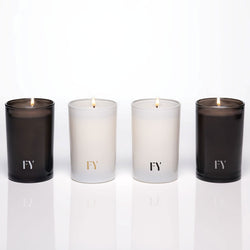 Lit hand-poured votive candles by FREE YOURSELF, made in Vermont