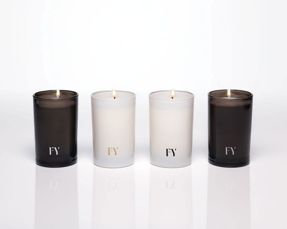Lit hand-poured votive candles by FREE YOURSELF, made in Vermont