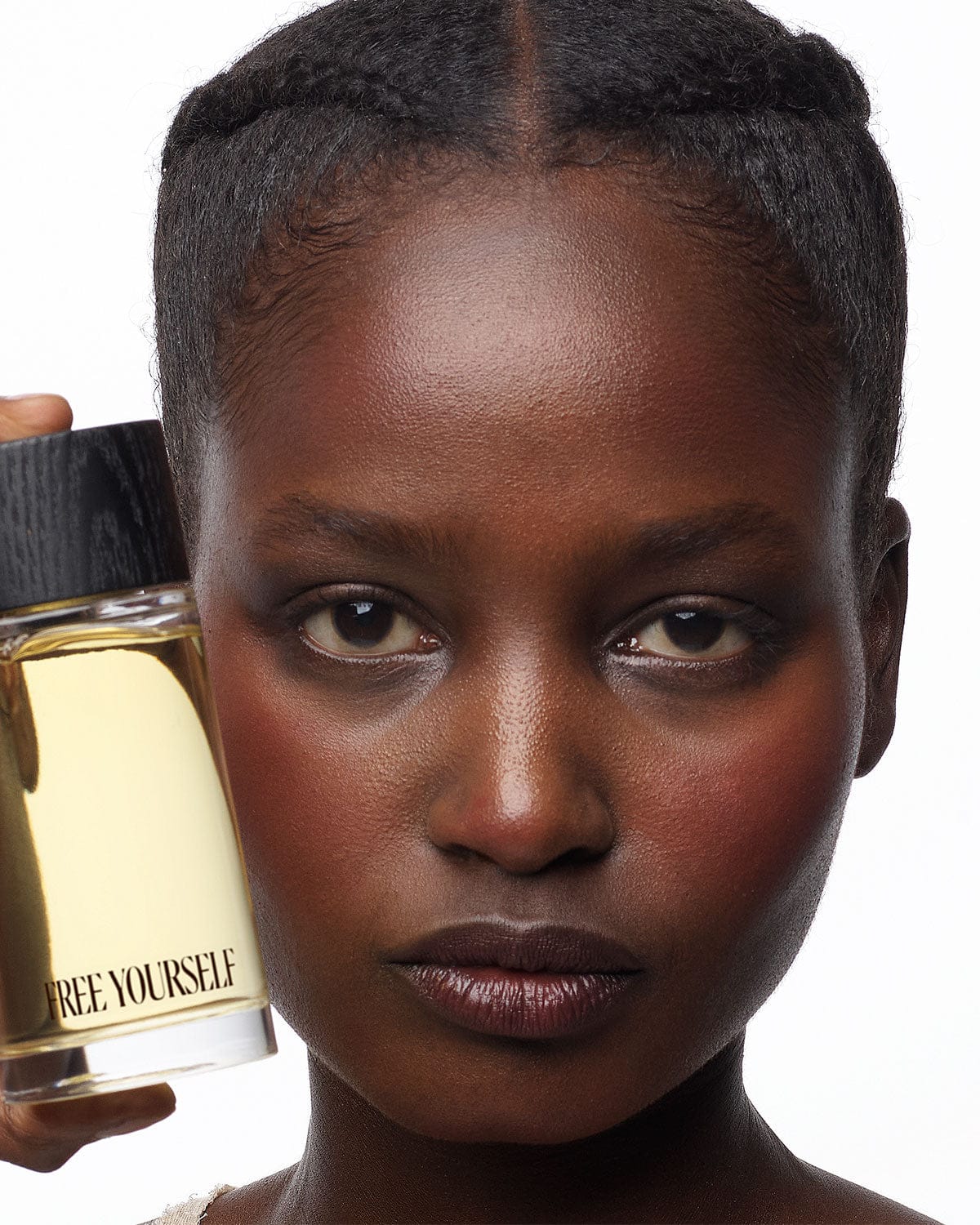 Free Yourself 100ml EDP bottle held by model